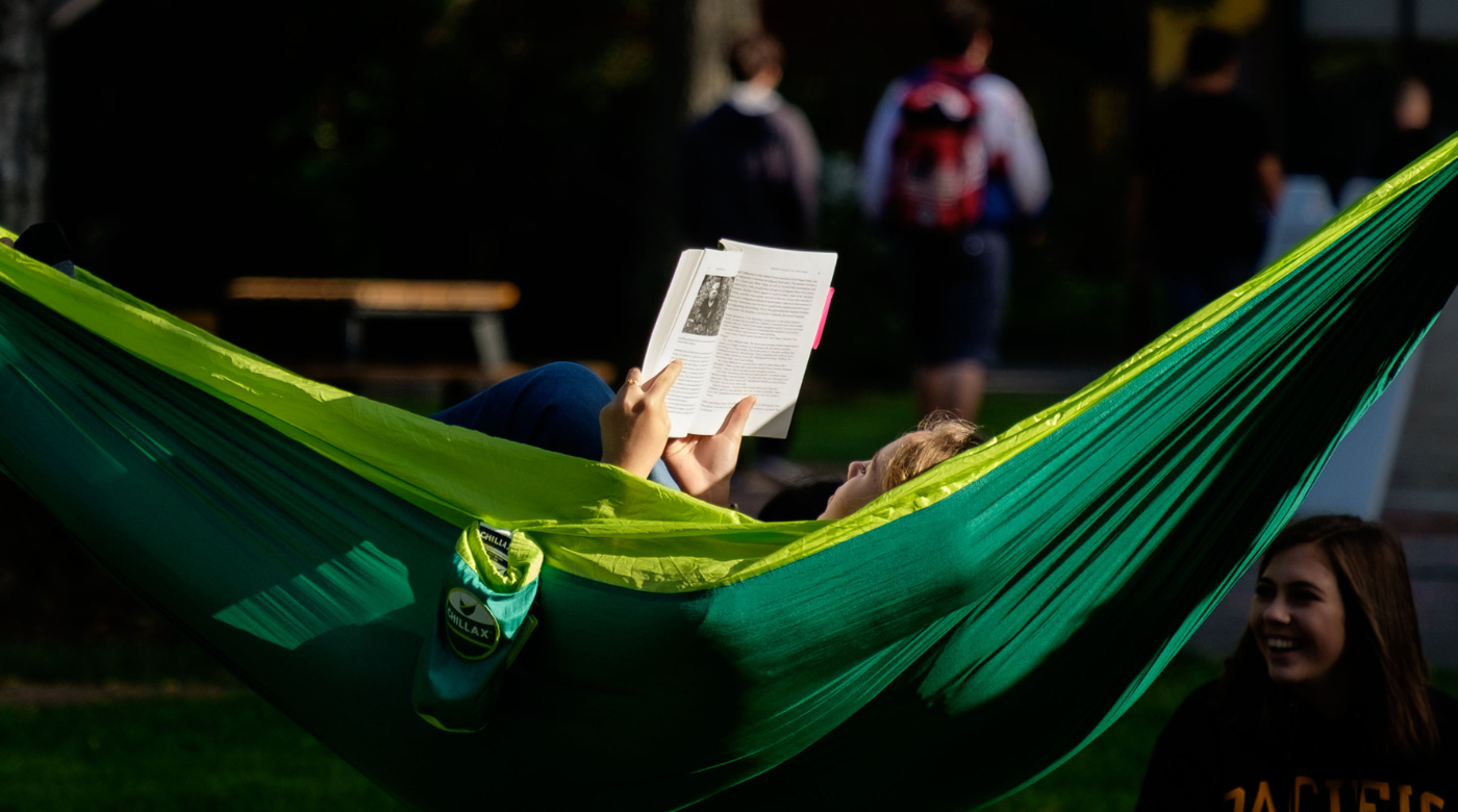 Student studying in a hammock in the sunshine on a fall day at PLU, Wednesday, Sept. 19, 2018. (Photo/John Froschauer)
