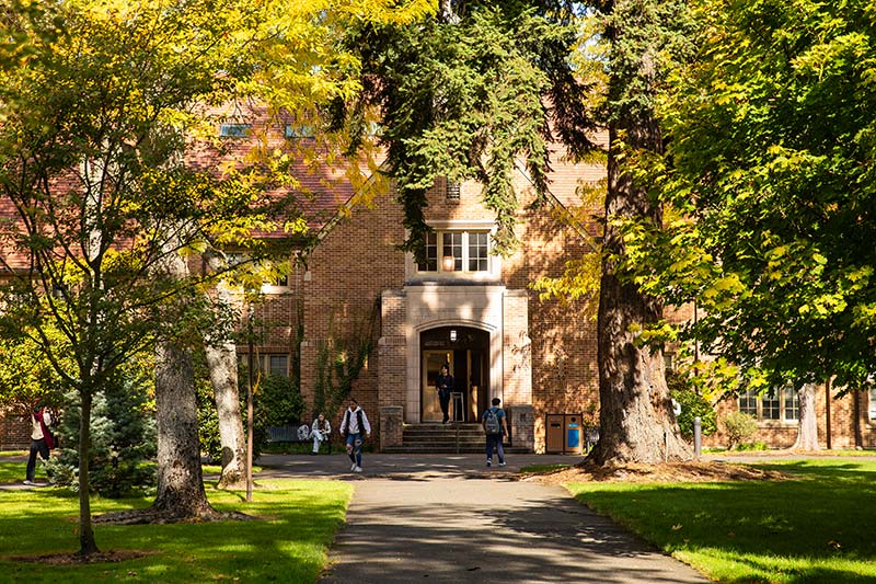 PLU students on campus outside Xavier