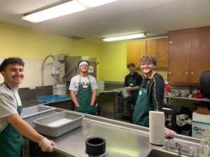 students dishwashing at Community Meal