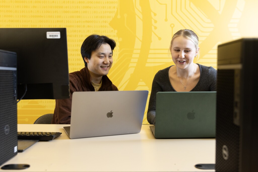 Two students working at computers