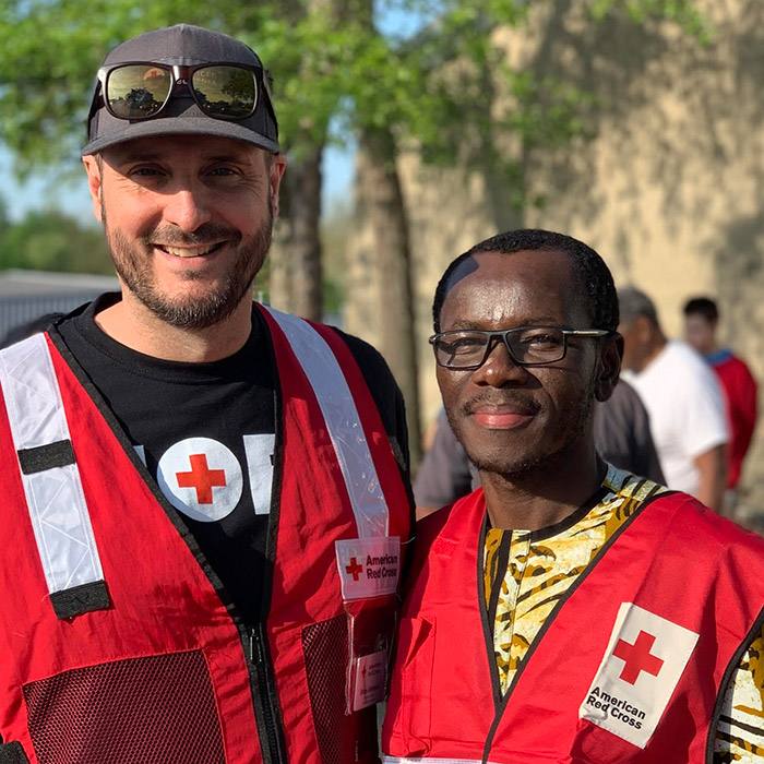 Brice Johnson with American Red Cross intern Elvis Dun-Dery at a community cleanup event.