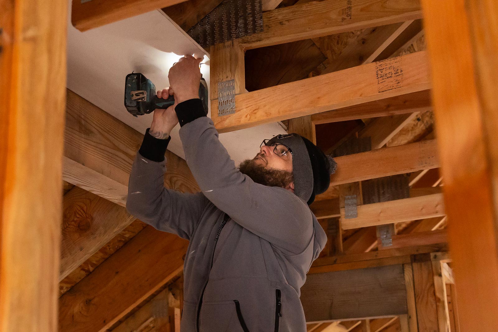 Students in SOCW 175 volunteer to help build houses at a Habitat for Humanity site in Lakewood, Wednesday, Jan. 15, 2025. The course is an intense experience of service and community work on Tacoma's Hilltop District and Tacoma's eastside where students learn firsthand about poverty and participate in community projects. (PLU Photo / Sy Bean)