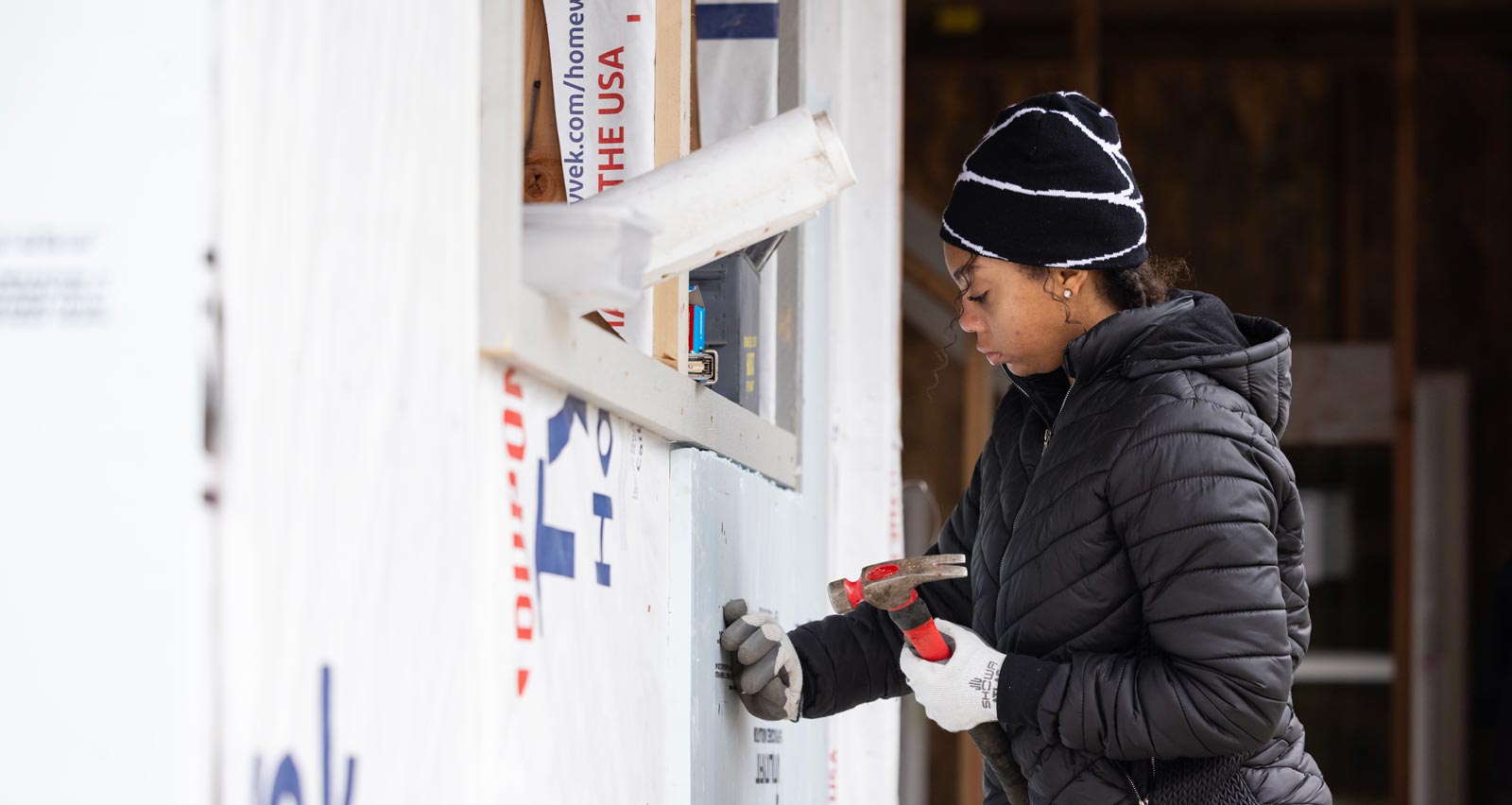 Students in SOCW 175 volunteer to help build houses at a Habitat for Humanity site in Lakewood, Wednesday, Jan. 15, 2025. The course is an intense experience of service and community work on Tacoma's Hilltop District and Tacoma's eastside where students learn firsthand about poverty and participate in community projects. (PLU Photo / Sy Bean)