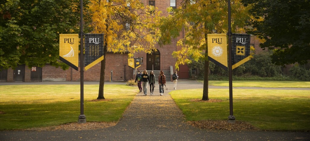 PLU Grad Week: Image of students walking on upper quad